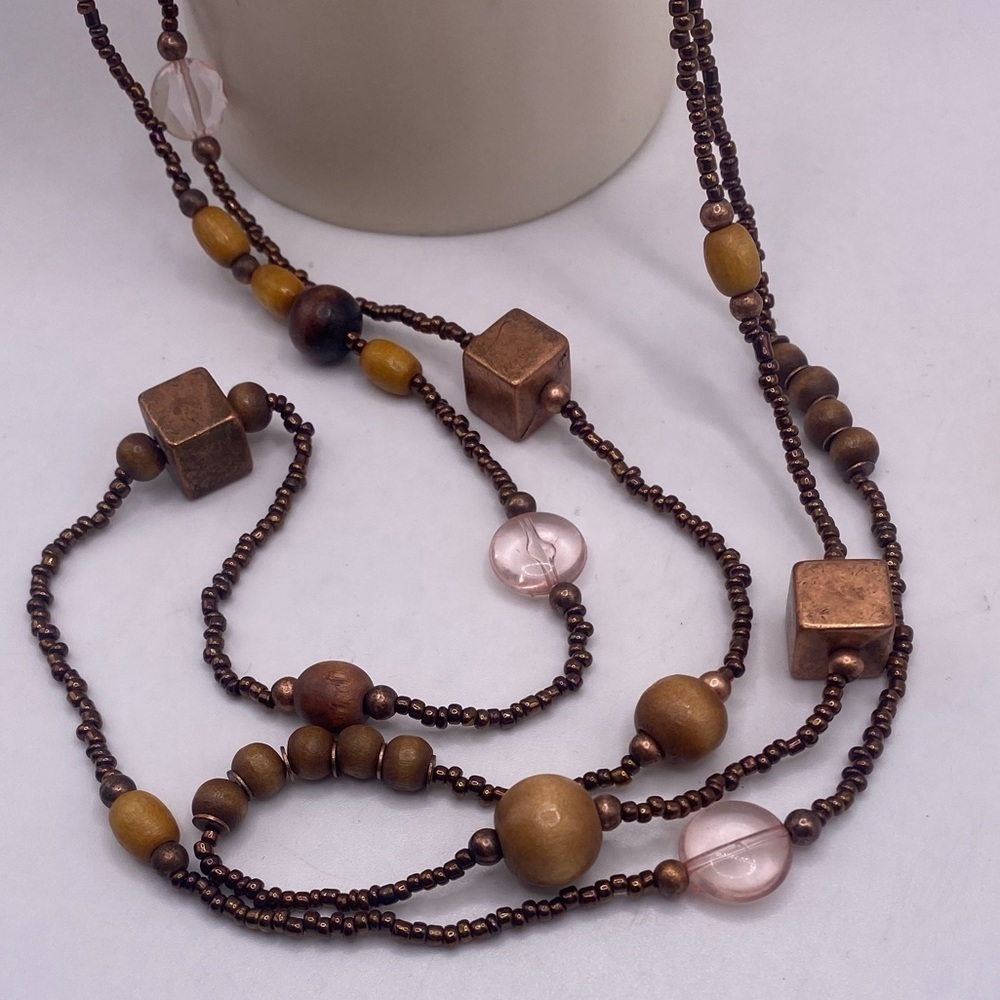 Nice Beaded Necklace with beads and metallic copper colored geometric squares.